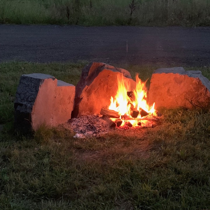 Campfire burning in a stone fire ring