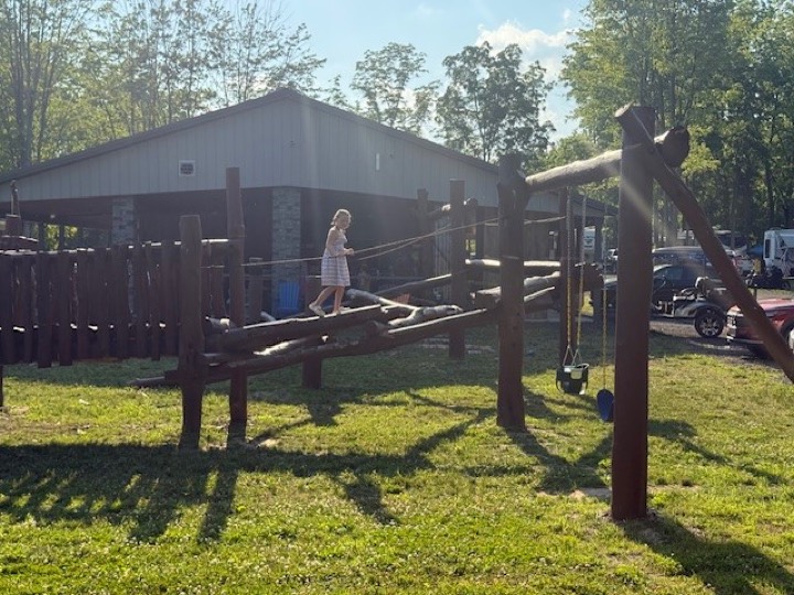 Wooden playground next to the pavilion