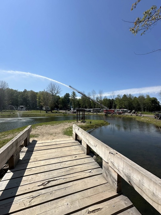 Wooden dock on the pond with a rainbow overhead