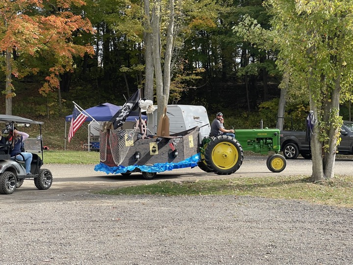 Tractor and golf carts in the campground parade